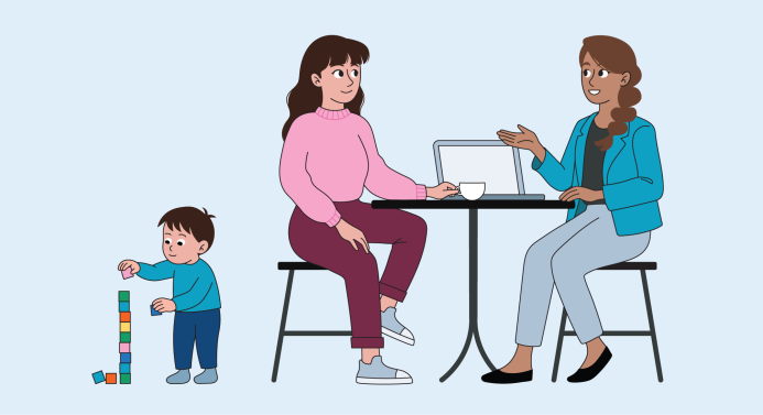 A mother and a coach sit at a table talking, while a child plays with building blocks beside them.